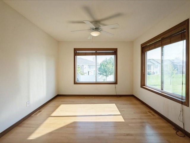 3314 35th Ave, Marion, IA 52302 - unfurnished room featuring light wood finished floors, baseboards, and ceiling fan