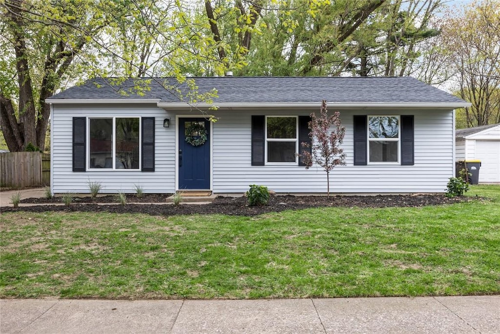 2227 California Ave, Iowa City, IA 52240 - ranch-style house with entry steps, a shingled roof, and a garage