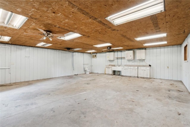 306 7th Ave, Clarence, IA 52216 - garage featuring a sink