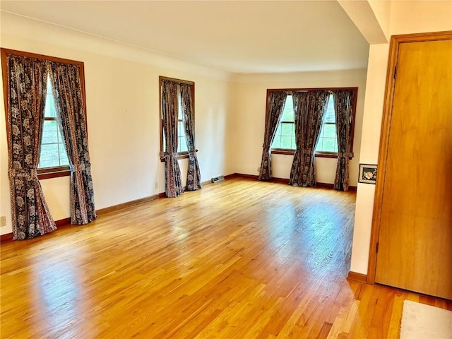 832 17th St SE, Cedar Rapids, IA 52403 - unfurnished room featuring light wood finished floors and baseboards