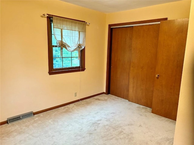 832 17th St SE, Cedar Rapids, IA 52403 - unfurnished bedroom featuring carpet, a closet, and baseboards