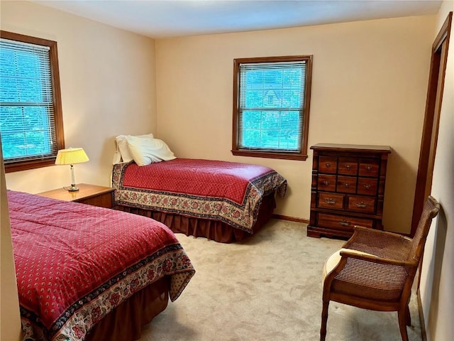 832 17th St SE, Cedar Rapids, IA 52403 - carpeted bedroom featuring multiple windows