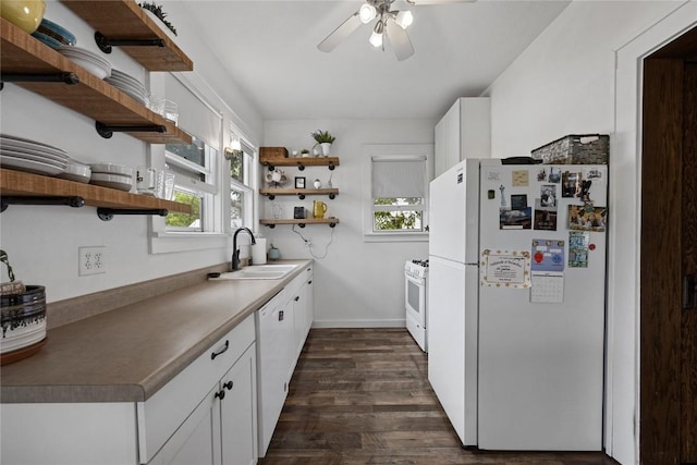 540 E 4th St, Tipton, IA 52772 - kitchen with open shelves, white appliances, a sink, ceiling fan, and dark wood-type flooring