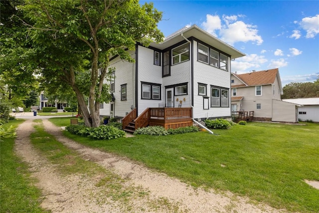 540 E 4th St, Tipton, IA 52772 - rear view of house featuring a lawn