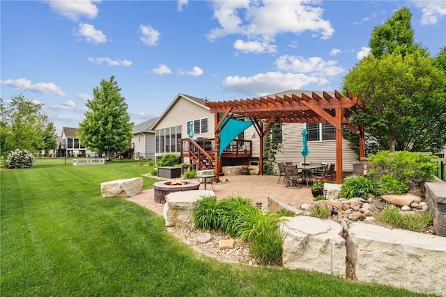 1617 Hunters Field Ln, Marion, IA 52302 - rear view of property with a fire pit, a pergola, a patio area, and a yard