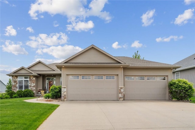1617 Hunters Field Ln, Marion, IA 52302 - view of front of house featuring an attached garage, concrete driveway, and stone siding