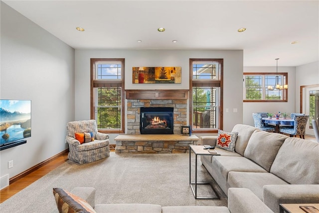 1617 Hunters Field Ln, Marion, IA 52302 - living area with a chandelier, healthy amount of natural light, wood finished floors, recessed lighting, and a fireplace