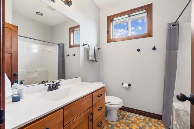 1617 Hunters Field Ln, Marion, IA 52302 - bathroom with vanity, toilet, a shower with shower curtain, and baseboards