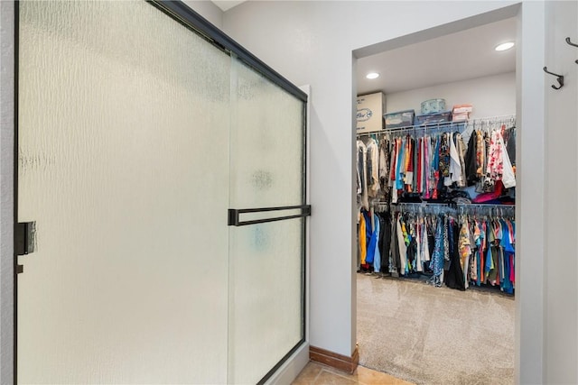 1617 Hunters Field Ln, Marion, IA 52302 - full bath featuring a stall shower, a walk in closet, and recessed lighting