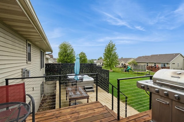 2806 Dawn Ave SW, Cedar Rapids, IA 52404 - deck featuring grilling area, a playground, and a residential view