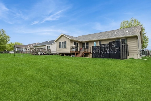 2806 Dawn Ave SW, Cedar Rapids, IA 52404 - back of property featuring a deck and a yard
