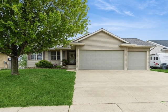 2806 Dawn Ave SW, Cedar Rapids, IA 52404 - single story home with a garage, driveway, a front lawn, and roof with shingles