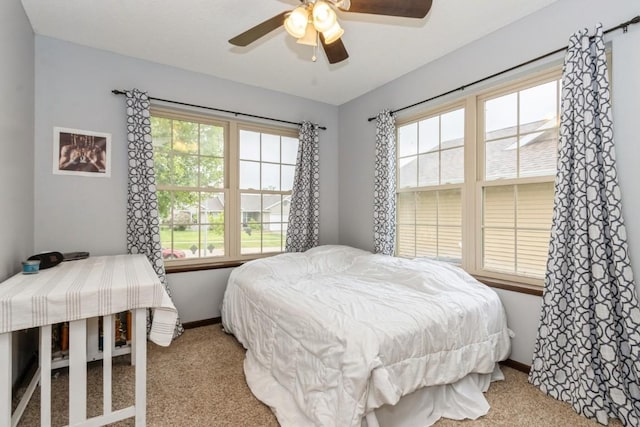 2806 Dawn Ave SW, Cedar Rapids, IA 52404 - carpeted bedroom with multiple windows and ceiling fan