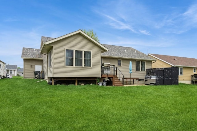 2806 Dawn Ave SW, Cedar Rapids, IA 52404 - back of house featuring a lawn and a shingled roof