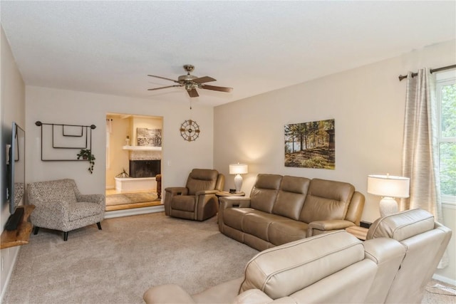 2232 Birchwood Dr NE, Cedar Rapids, IA 52402 - living room featuring a ceiling fan and light carpet