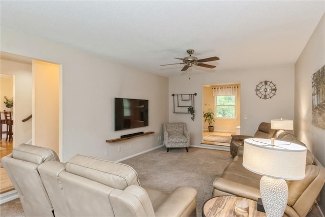 2232 Birchwood Dr NE, Cedar Rapids, IA 52402 - living area with a ceiling fan, carpet floors, and baseboards