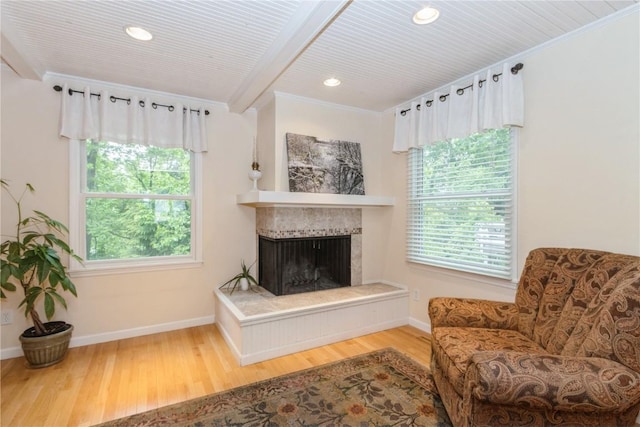 2232 Birchwood Dr NE, Cedar Rapids, IA 52402 - sitting room with wood finished floors, plenty of natural light, baseboards, beam ceiling, and recessed lighting