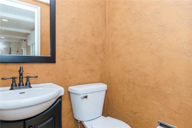 2232 Birchwood Dr NE, Cedar Rapids, IA 52402 - half bathroom featuring vanity and toilet