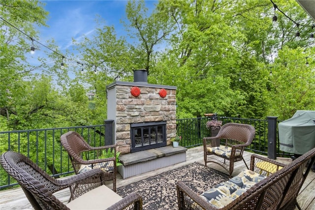 2232 Birchwood Dr NE, Cedar Rapids, IA 52402 - view of patio featuring an outdoor living space with a fireplace and area for grilling