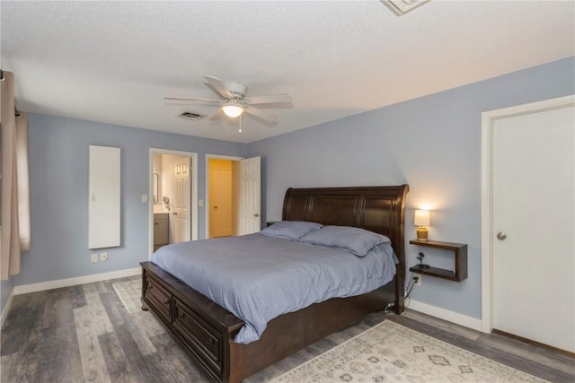 2232 Birchwood Dr NE, Cedar Rapids, IA 52402 - bedroom with baseboards, wood finished floors, ceiling fan, and ensuite bath
