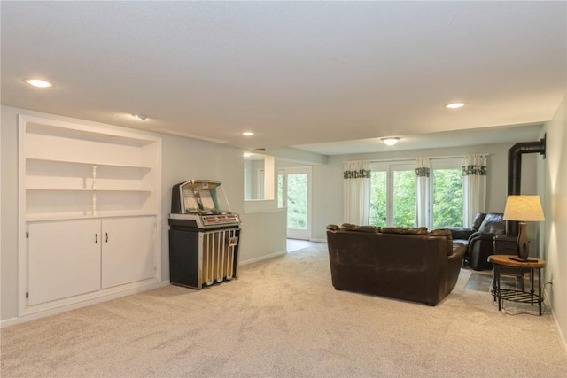 2232 Birchwood Dr NE, Cedar Rapids, IA 52402 - living area featuring light colored carpet, recessed lighting, and baseboards