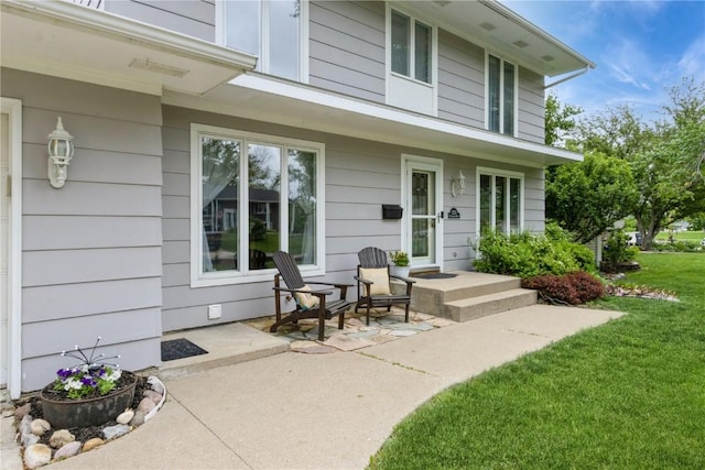 2232 Birchwood Dr NE, Cedar Rapids, IA 52402 - view of exterior entry featuring a lawn