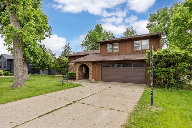 2623 Iris Ave NW, Cedar Rapids, IA 52405 - view of front of property with driveway, an attached garage, and a front lawn