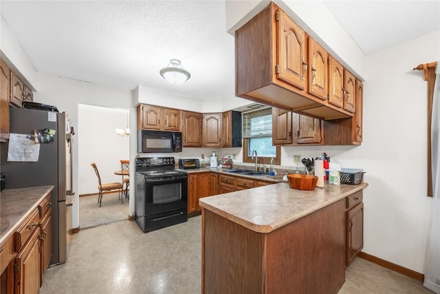 2623 Iris Ave NW, Cedar Rapids, IA 52405 - kitchen featuring black appliances, a sink, a peninsula, brown cabinets, and baseboards
