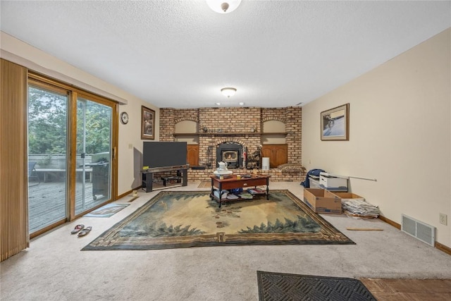 2623 Iris Ave NW, Cedar Rapids, IA 52405 - carpeted living room featuring a textured ceiling, a brick fireplace, and baseboards