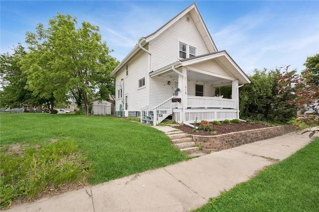 619 I Ave NW, Cedar Rapids, IA 52405 - view of front facade featuring covered porch and a front lawn