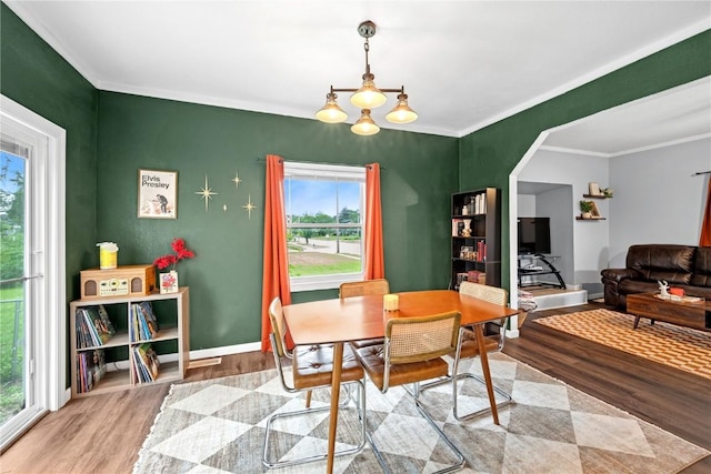 619 I Ave NW, Cedar Rapids, IA 52405 - dining room with wood finished floors, healthy amount of natural light, ornamental molding, and baseboards