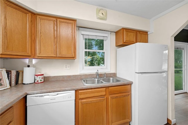 619 I Ave NW, Cedar Rapids, IA 52405 - kitchen with white appliances, a sink, and light countertops