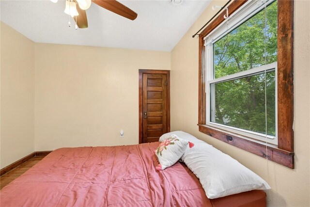 619 I Ave NW, Cedar Rapids, IA 52405 - bedroom with wood finished floors, a ceiling fan, and baseboards