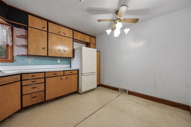 307 2nd Ave, Clarence, IA 52216 - kitchen with freestanding refrigerator, open shelves, a ceiling fan, baseboards, and light countertops