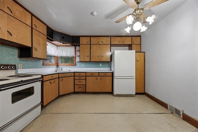 307 2nd Ave, Clarence, IA 52216 - kitchen with white appliances, light countertops, a ceiling fan, and baseboards
