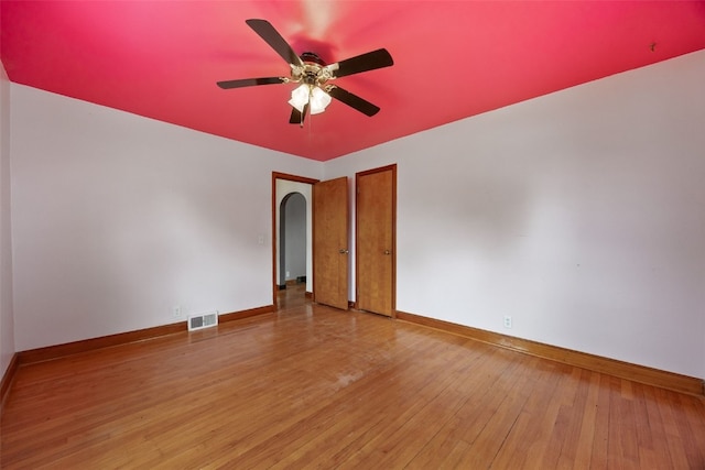 307 2nd Ave, Clarence, IA 52216 - spare room featuring hardwood / wood-style floors, baseboards, and ceiling fan