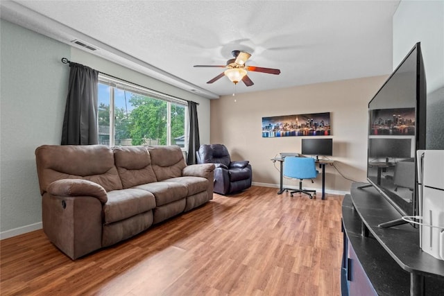 3107 Johnson Ave NW Unit 4, Cedar Rapids, IA 52405 - living room with a ceiling fan, light wood-type flooring, and baseboards