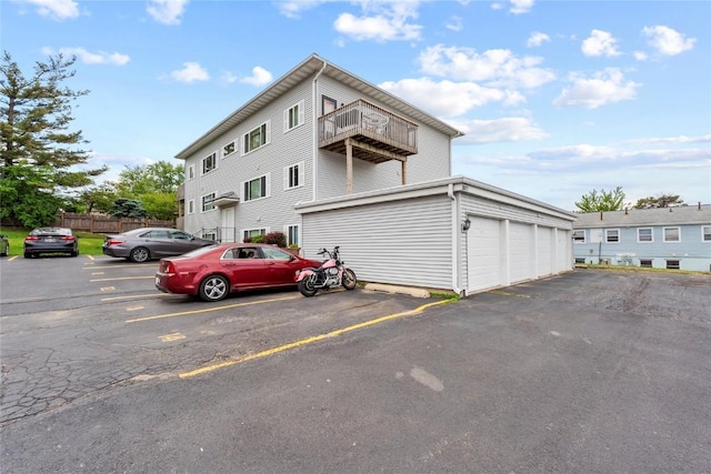 3107 Johnson Ave NW Unit 4, Cedar Rapids, IA 52405 - view of front of property with a balcony and uncovered parking