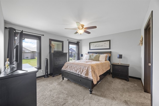 2205 Snapdragon Cir SW, Cedar Rapids, IA 52404 - carpeted bedroom featuring a ceiling fan and baseboards