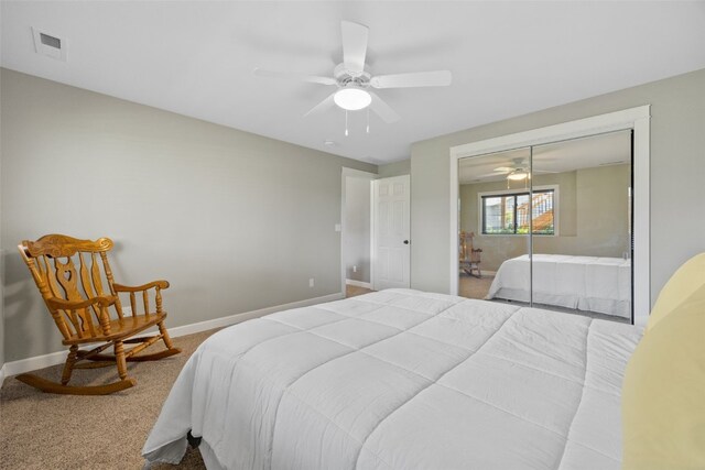 2205 Snapdragon Cir SW, Cedar Rapids, IA 52404 - bedroom with carpet, baseboards, a ceiling fan, and a closet