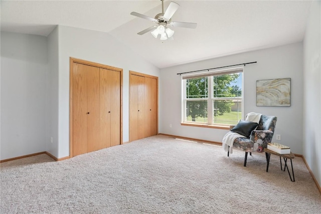 1562 Hunters Creek Way, Marion, IA 52302 - living area featuring carpet floors, vaulted ceiling, and a ceiling fan