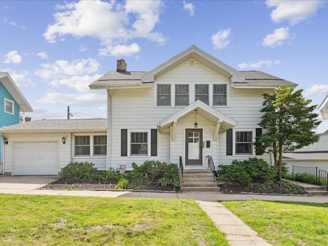 1813 3rd Ave SE, Cedar Rapids, IA 52403 - view of front facade with an attached garage, a chimney, a front lawn, and driveway