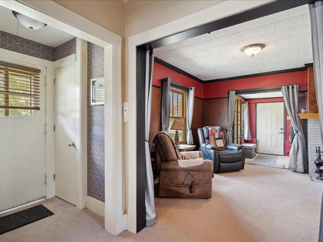 1813 3rd Ave SE, Cedar Rapids, IA 52403 - carpeted entryway featuring ornamental molding