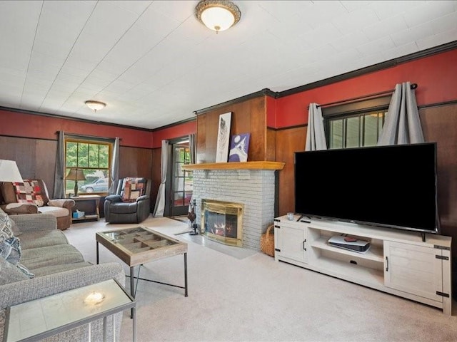 1813 3rd Ave SE, Cedar Rapids, IA 52403 - carpeted living area featuring a fireplace, wooden walls, and crown molding