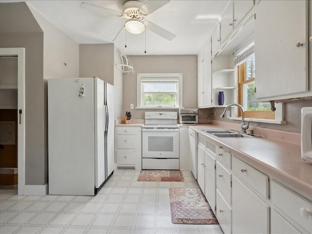 1813 3rd Ave SE, Cedar Rapids, IA 52403 - kitchen featuring white appliances, a sink, ceiling fan, light flooring, and open shelves