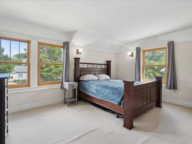 1813 3rd Ave SE, Cedar Rapids, IA 52403 - carpeted bedroom featuring lofted ceiling and baseboards