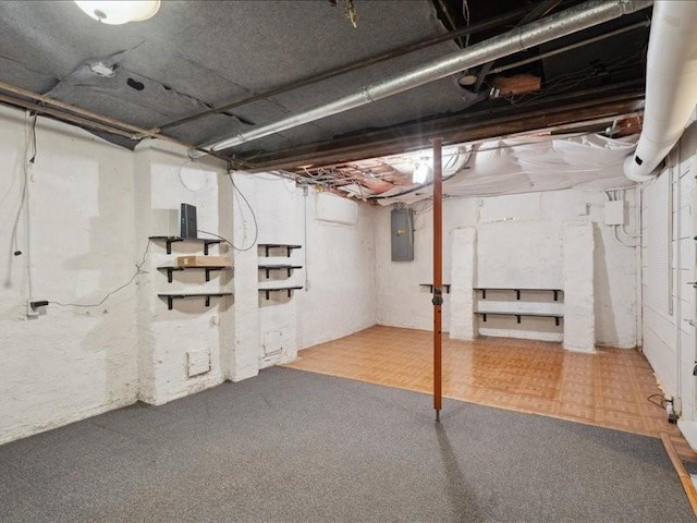 1813 3rd Ave SE, Cedar Rapids, IA 52403 - unfinished basement with electric panel and carpet