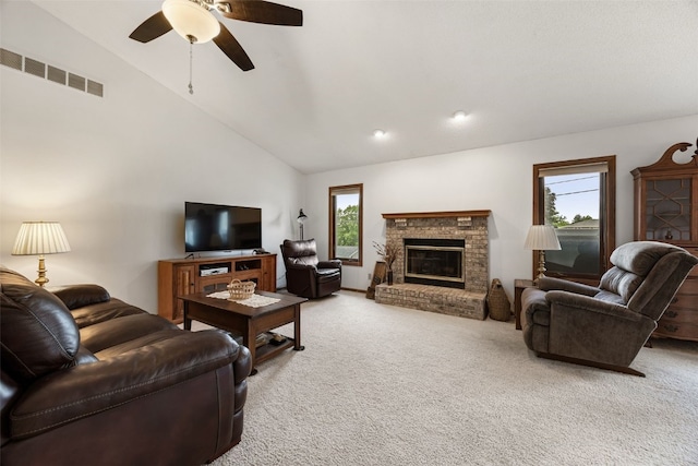 1724 Hamer Dr NW, Cedar Rapids, IA 52405 - living room featuring carpet, ceiling fan, a fireplace, and high vaulted ceiling