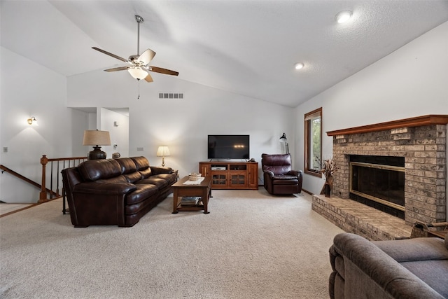 1724 Hamer Dr NW, Cedar Rapids, IA 52405 - living room with vaulted ceiling, a ceiling fan, carpet, and a brick fireplace