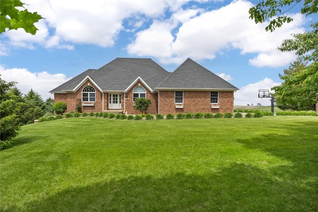 1355 Red Star Rd, Tipton, IA 52772 - view of front of property with a front lawn, brick siding, and a shingled roof